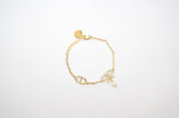 Gold Bow CZ Bracelet with Pearl Charm