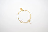 Gold Bow CZ Bracelet with Pearl Charm