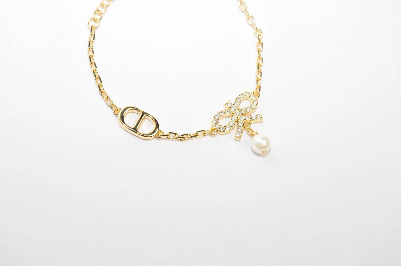 Gold Bow CZ Bracelet with Pearl Charm