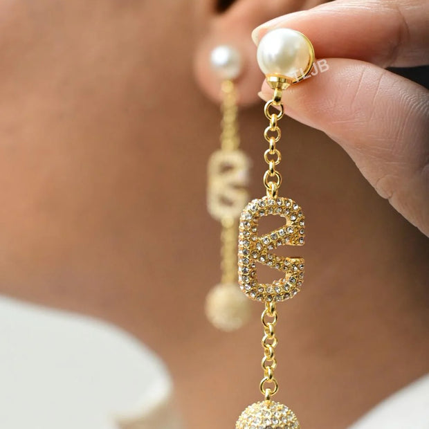 Alphabet V gold long chain danglers with cz ball
