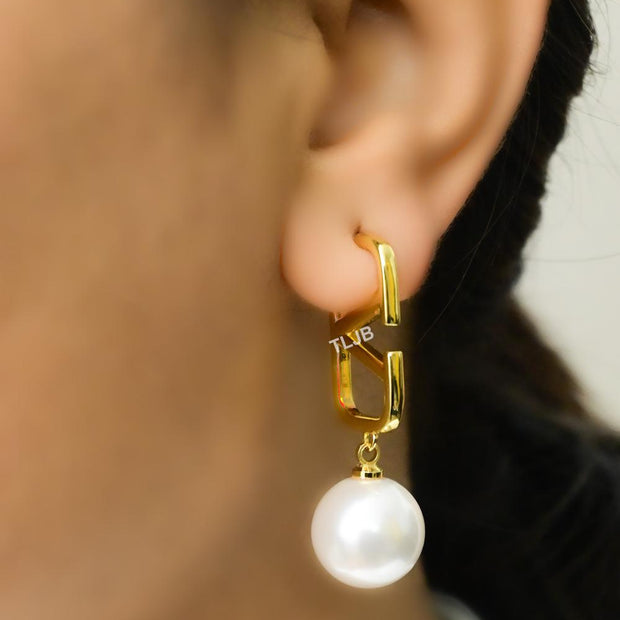 Open V and pearl earrings