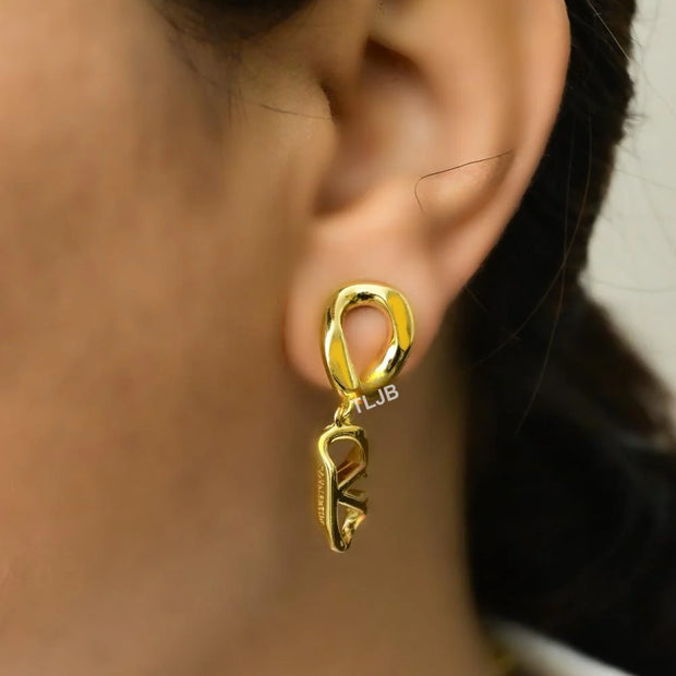 Open V twisted gold earrings