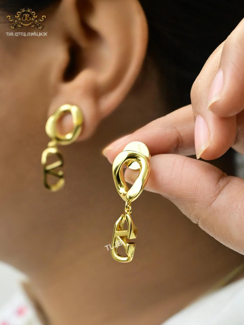 Alphabet V twisted gold danglers