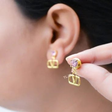 Alphabet V gold and pink stone studs