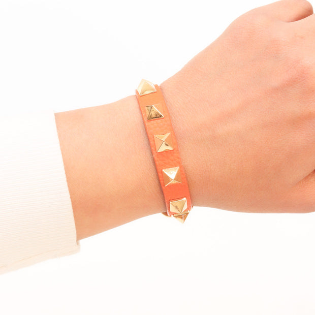 Alphabet V rockstud orange bracelet