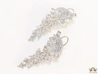 Cz and baguette dangles in platinum finish