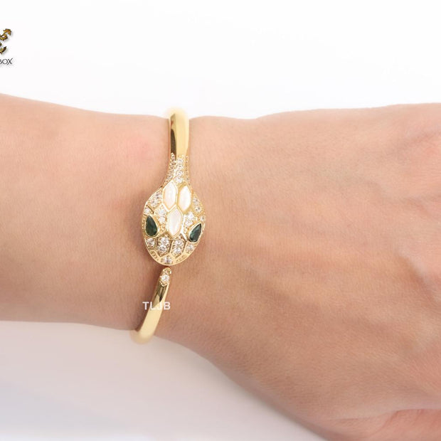 Snake head gold and white MOP bracelet with cz
