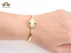 Snake head gold and white MOP bracelet with cz