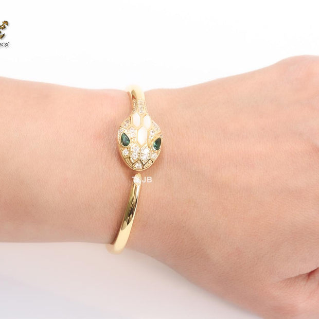 Snake head gold and white MOP bracelet with cz