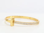 Alphabet T bracelet with half CZ in gold finish