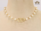 Alphabet V pearl and gold necklace
