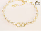 Alphabet V pearl and gold necklace