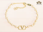 Alphabet V pearl and gold necklace