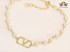 Alphabet V pearl and gold necklace