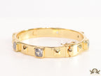 Band style bracelet in gold plating with gold plated details and cubic zirconia stones