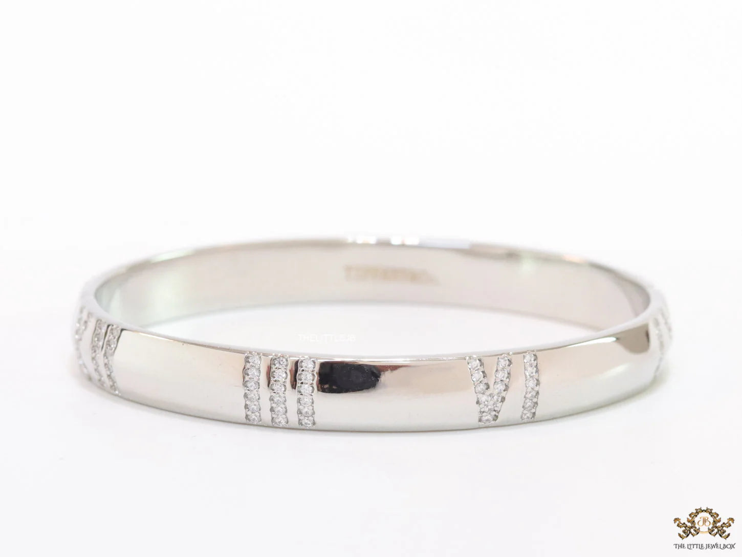 Platinum plated bracelet with cz roman numerals