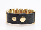 Alphabet M black colour bracelet in gold finish