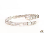 Open top platinum plated minimal snake bracelet with cubic zirconia stones and pearl white stones.
