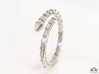 Open top platinum plated minimal snake bracelet with cubic zirconia stones and pearl white stones.