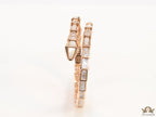 Open top rose gold plated minimal serpentine bracelet with cubic zirconia stones and pearl white stones.