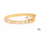 Open top gold plated minimal serpentine bracelet with cubic zirconia stones and pearl white stones.