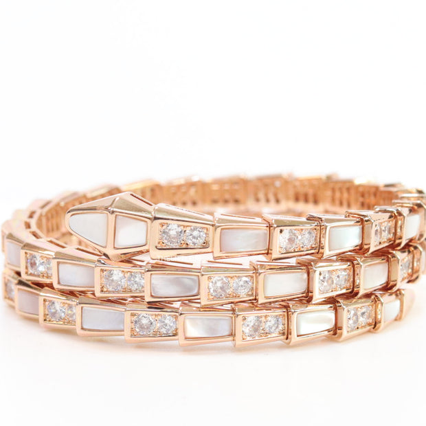 Triple line rose gold plated minimal snake bracelet with cubic zirconia stones and pearl white stones.