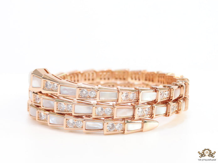 Triple line rose gold plated minimal snake bracelet with cubic zirconia stones and pearl white stones.