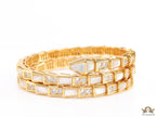 Triple line gold plated minimal snake bracelet with cubic zirconia stones and pearl white stones.