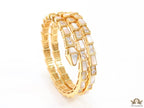 Triple line gold plated minimal snake bracelet with cubic zirconia stones and pearl white stones.