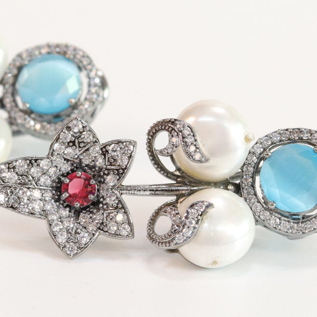 Cz flower earrings with shell pearls and light blue stones