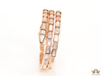 Triple line rose gold plated minimal serpentine bracelet with cubic zirconia stones and pearl white stones.