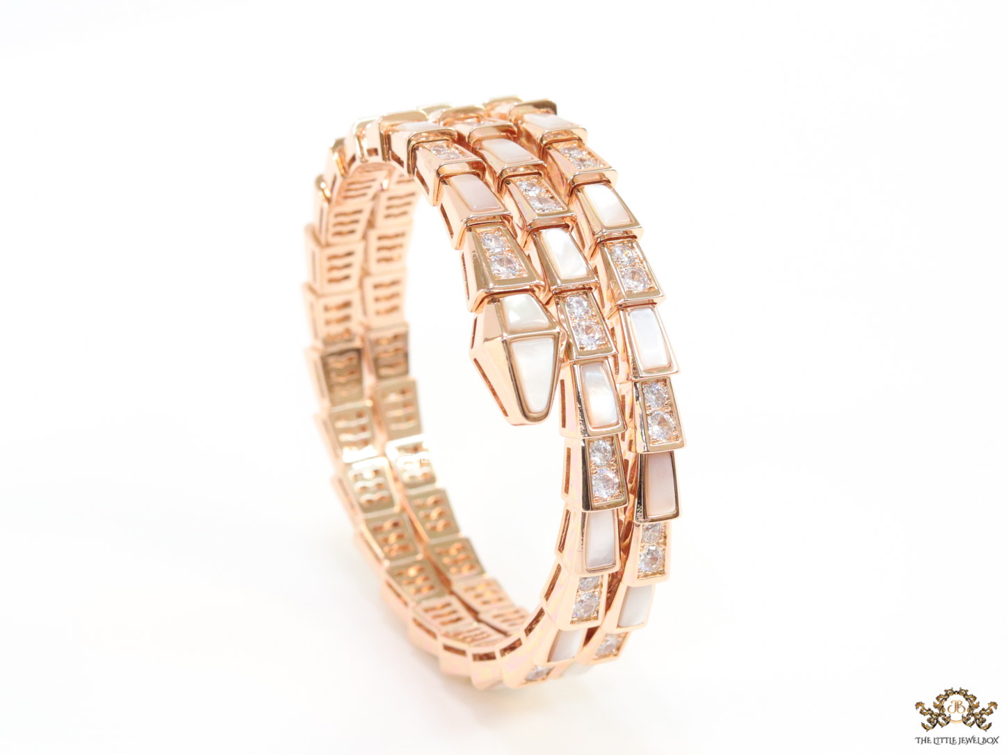 Triple line rose gold plated minimal snake bracelet with cubic zirconia stones and pearl white stones.