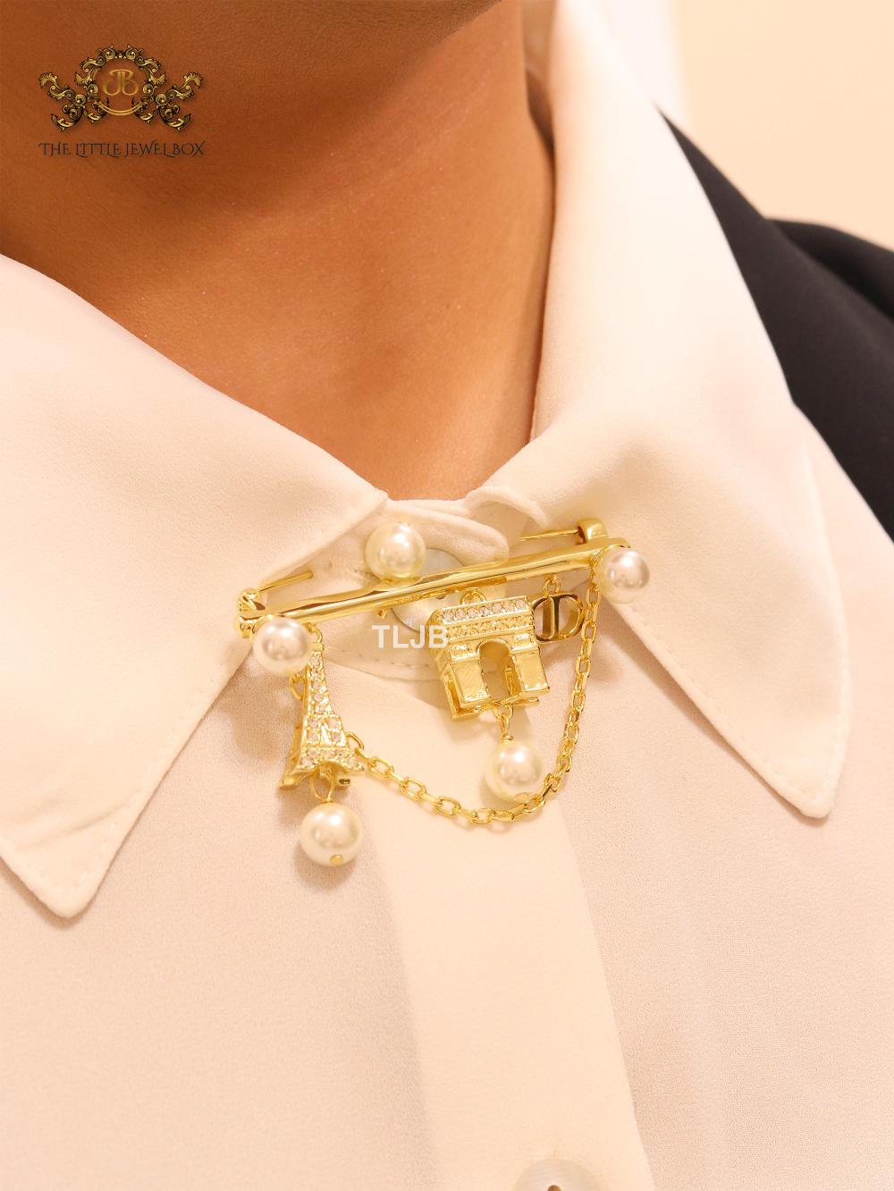 Charms brooch
