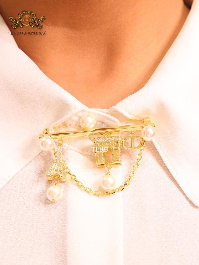 Charms brooch