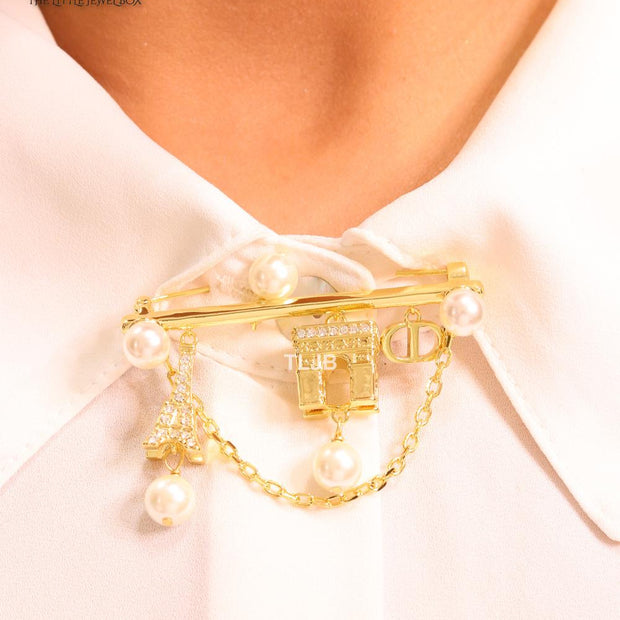 Charms brooch
