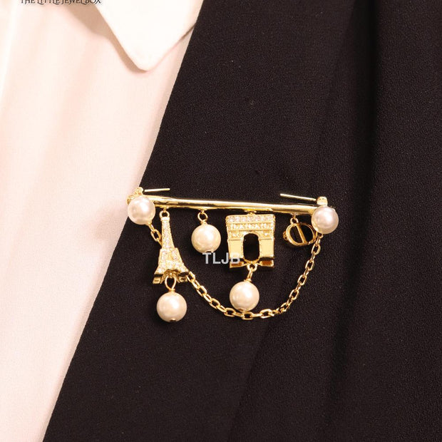 Charms brooch
