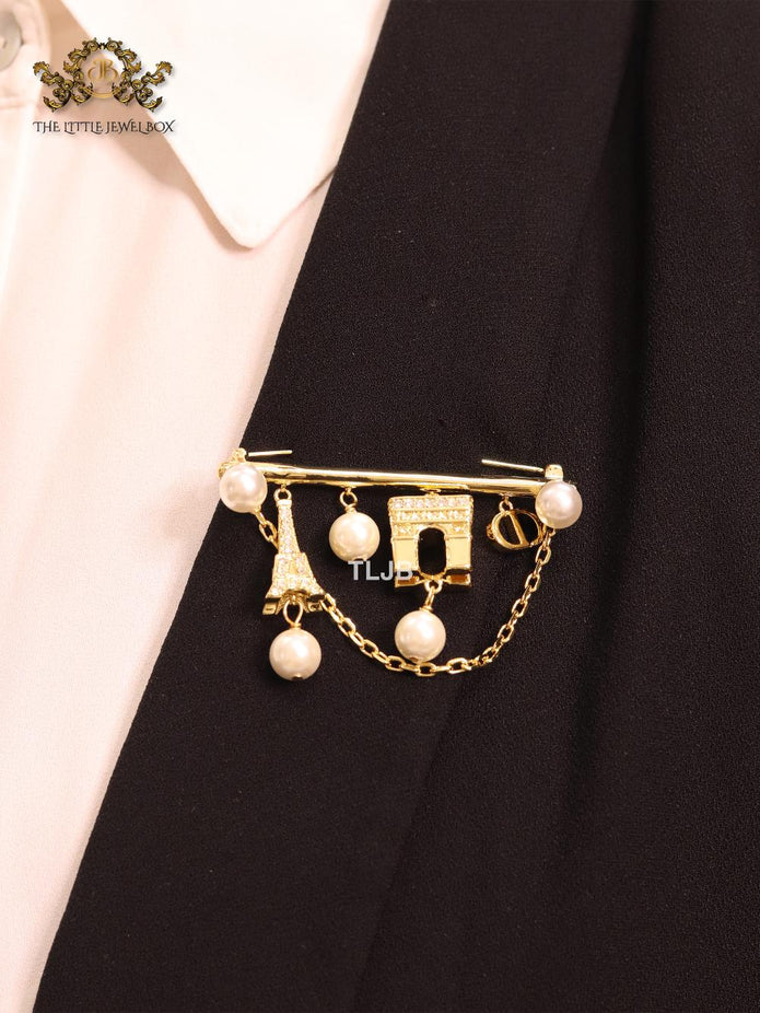 Charms brooch
