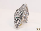Cubic zirconia stone studded panther motif with emerald green colour stone details platinum plated bracelet