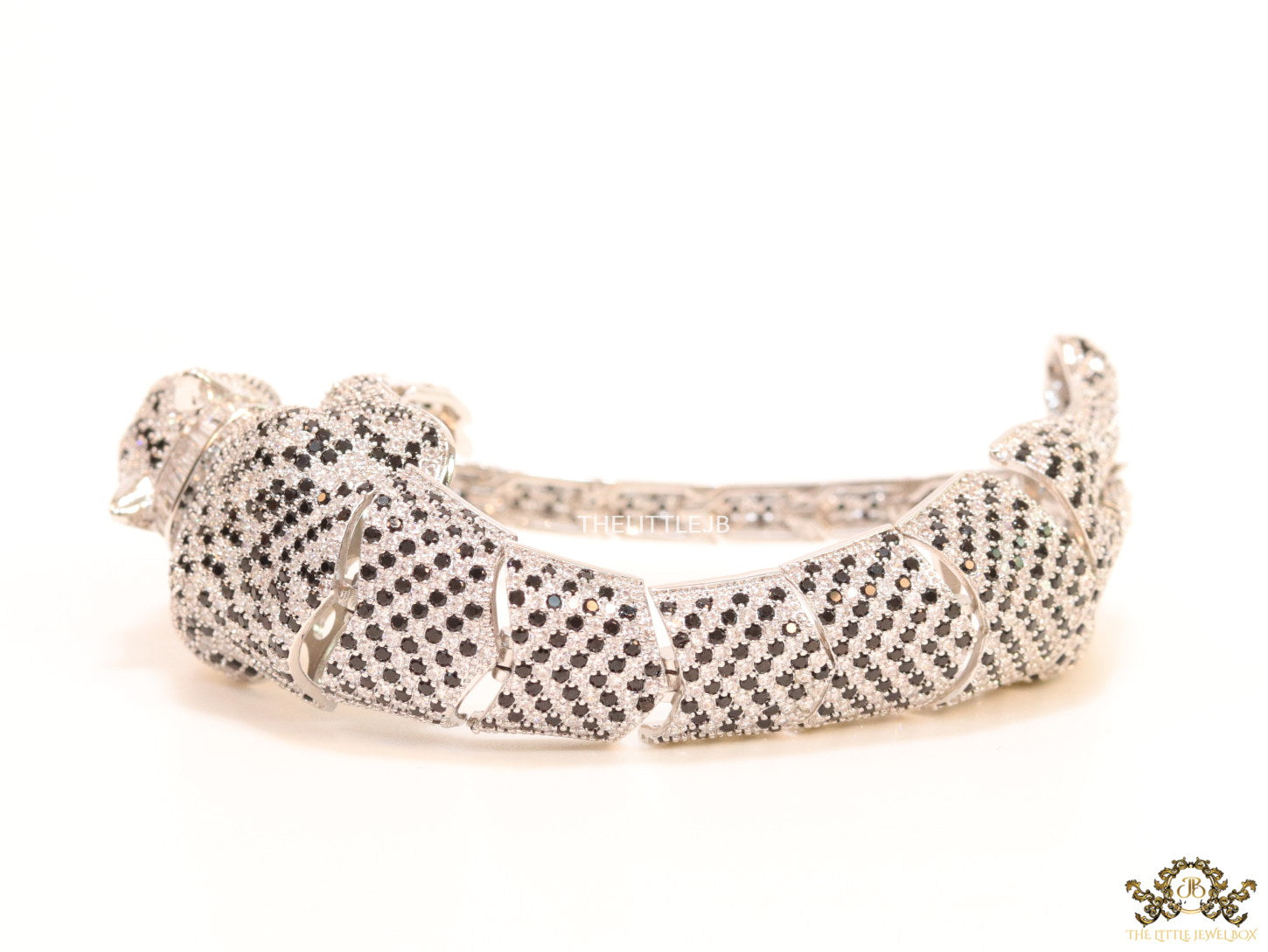 Cubic zirconia stone studded panther motif with emerald green colour stone details platinum plated bracelet