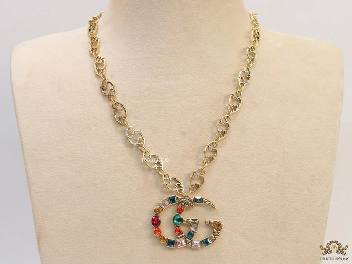 Golden fancy link chain necklace with multi cz twin G pendant