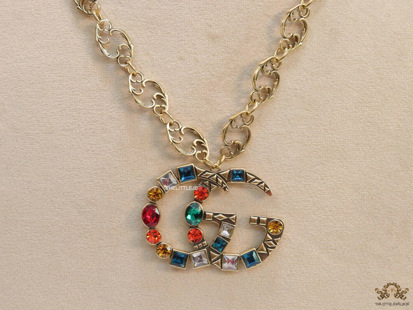 Golden fancy link chain necklace with multi cz twin G pendant