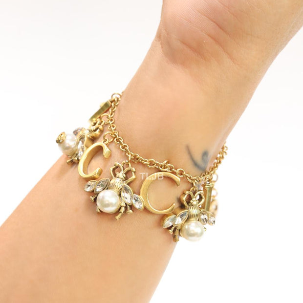 Double G bracelet with rustic charms bracelet