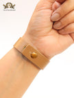 Alphabet D and tan belted bracelet