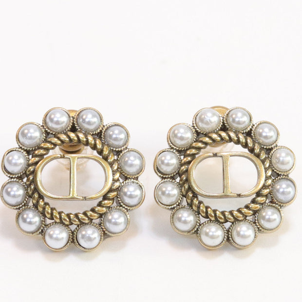 Gold plated round stud earrings with pearl lining and alphabets