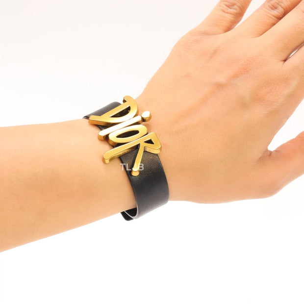 Alphabet D and black belted bracelet