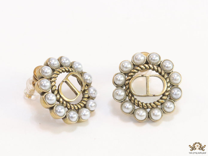 Gold plated round stud earrings with pearl lining and alphabets