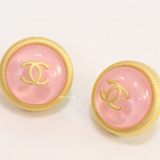Pink and golden round studs with twin C motif