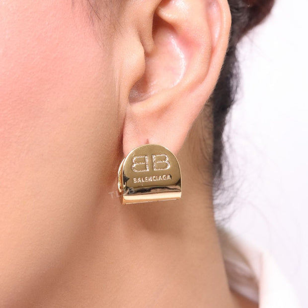 Gold double B studs