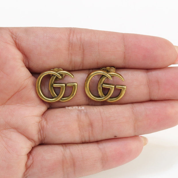 Gold plated twin G alphabet stud earrings