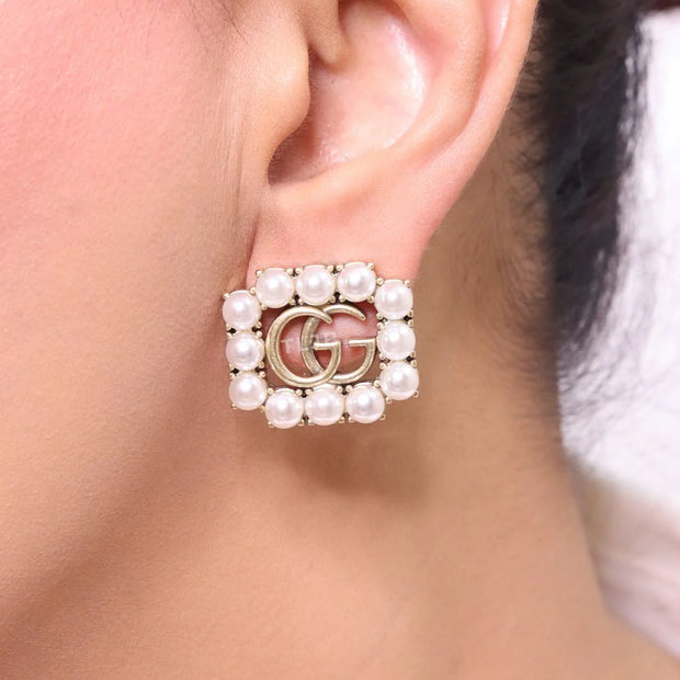 Double G rustic pearl studs